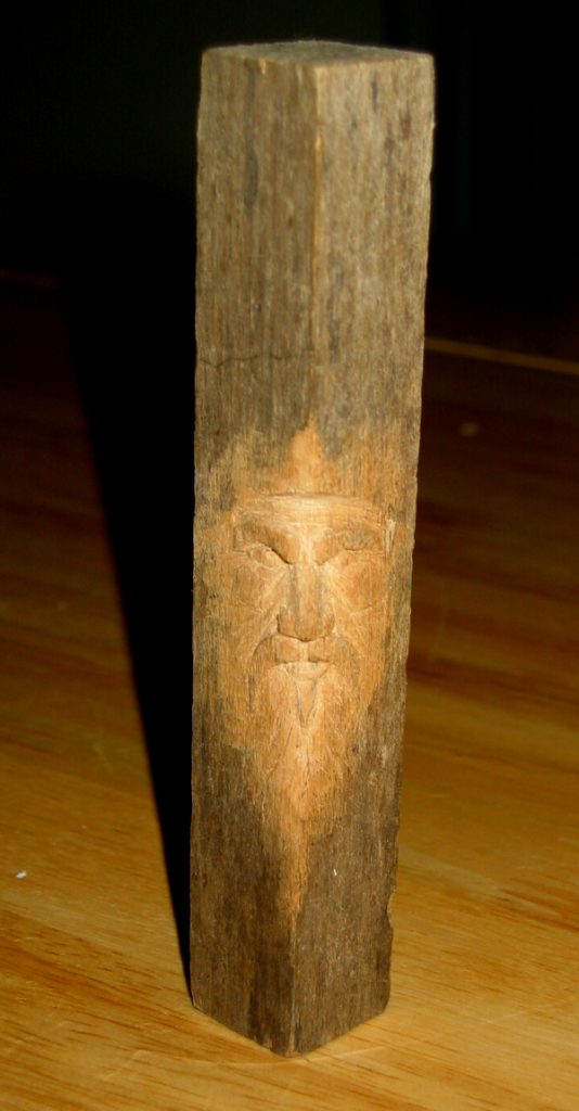 "Old Man Carving"
